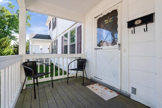 view of exterior entry featuring a porch