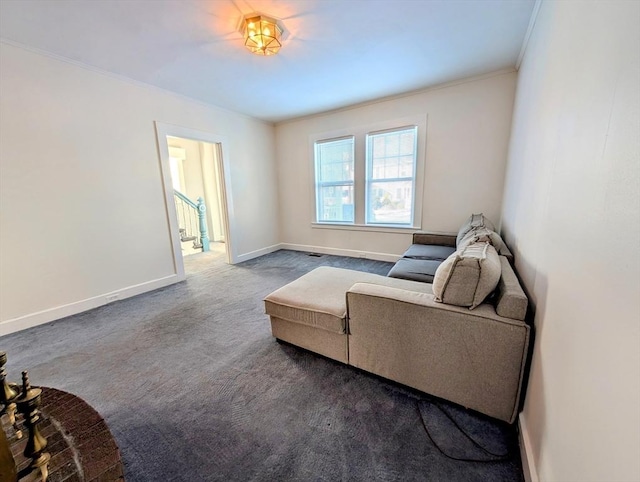 living area featuring ornamental molding and carpet