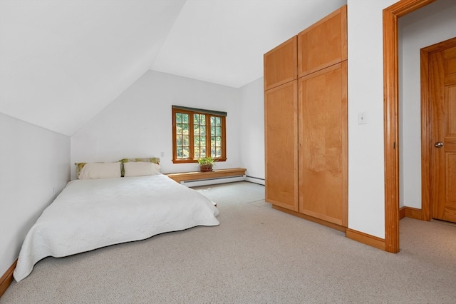 bedroom with a baseboard radiator, lofted ceiling, a closet, and light colored carpet