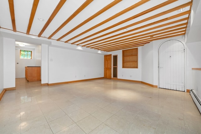 unfurnished living room featuring beam ceiling, baseboard heating, and light tile patterned floors