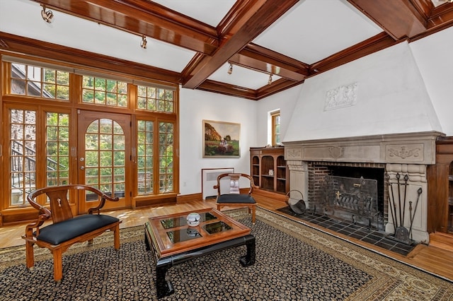 living room featuring ornamental molding, coffered ceiling, beam ceiling, and hardwood / wood-style flooring