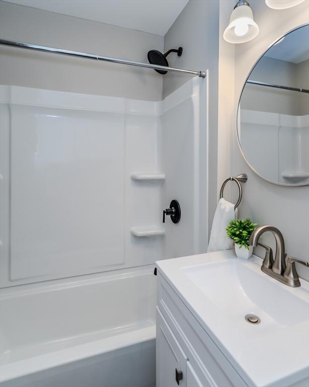 229 Saint James Blvd, Springfield, MA 01104 - bathroom featuring tub / shower combination and vanity
