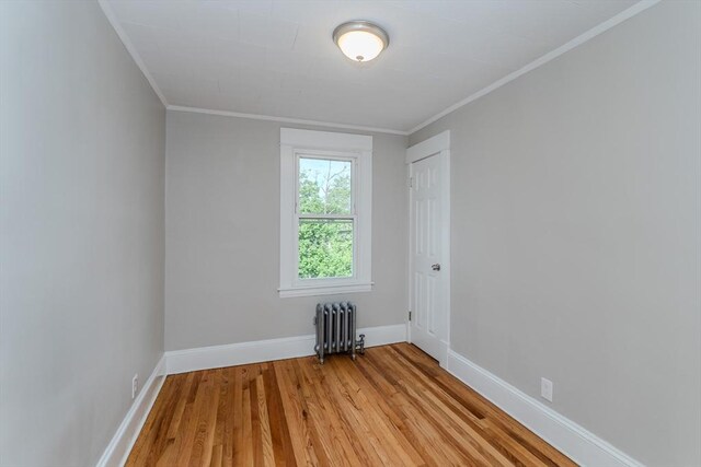 229 Saint James Blvd, Springfield, MA 01104 - unfurnished room with radiator, light wood-type flooring, ornamental molding, and baseboards