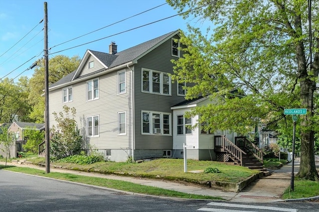229 Saint James Blvd, Springfield, MA 01104 - view of side of property with a chimney and a lawn