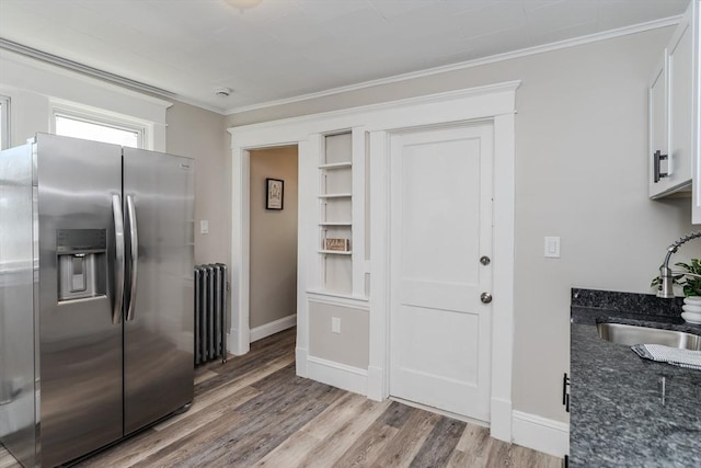 229 Saint James Blvd, Springfield, MA 01104 - kitchen featuring stainless steel fridge with ice dispenser, radiator, a sink, crown molding, and light wood-style floors