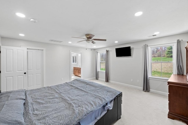 bedroom featuring light carpet, recessed lighting, and visible vents