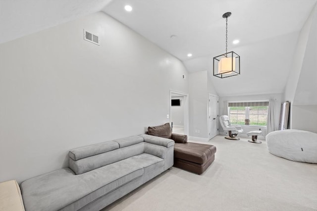 living area with light colored carpet, recessed lighting, visible vents, and high vaulted ceiling