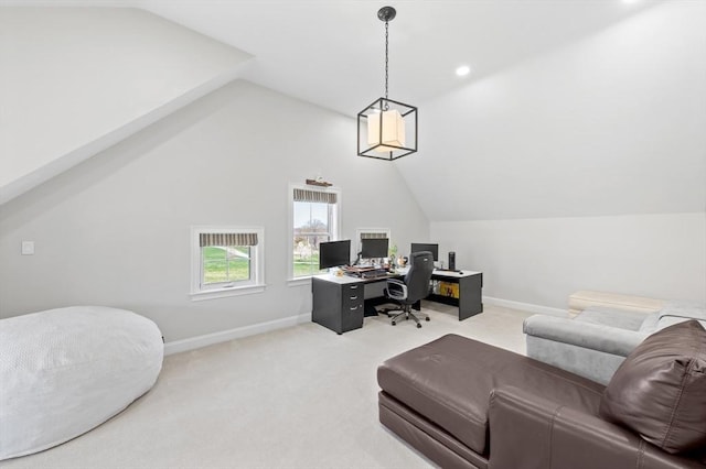 home office featuring baseboards, lofted ceiling, and light carpet