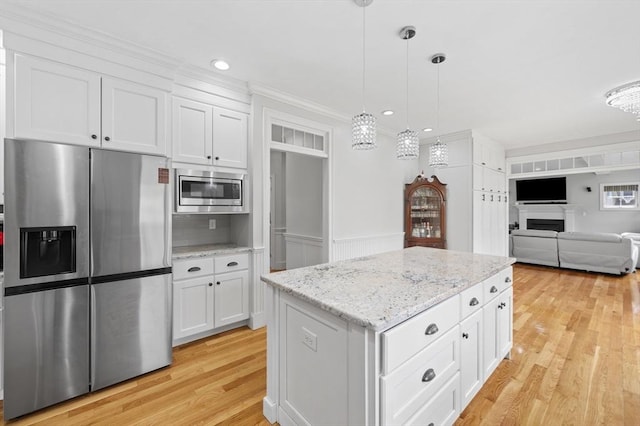 kitchen featuring white cabinetry, appliances with stainless steel finishes, and light wood-style floors