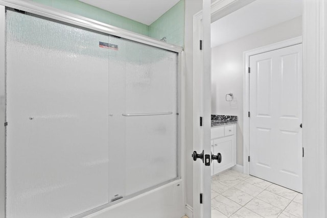 bathroom featuring vanity, marble finish floor, and an enclosed shower