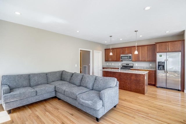 27 Boatwrights Loop, Plymouth, MA 02360 - living area featuring light wood finished floors and recessed lighting