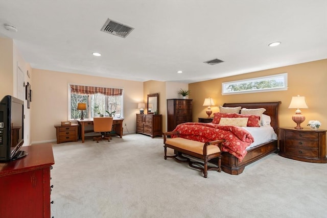 bedroom with light carpet, multiple windows, and visible vents