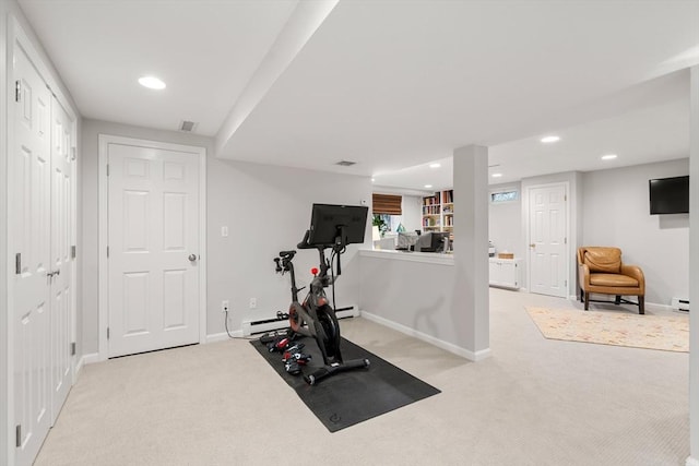 exercise area with recessed lighting, light carpet, and baseboards