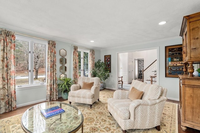 sitting room with baseboards, stairs, crown molding, light wood-style floors, and recessed lighting