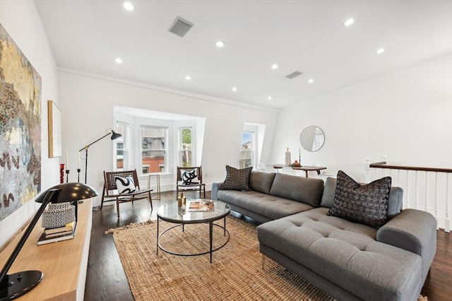 living room with crown molding and dark hardwood / wood-style flooring