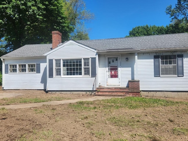 192 White St, Lunenburg, MA 01462 - view of front facade featuring a chimney and roof with shingles
