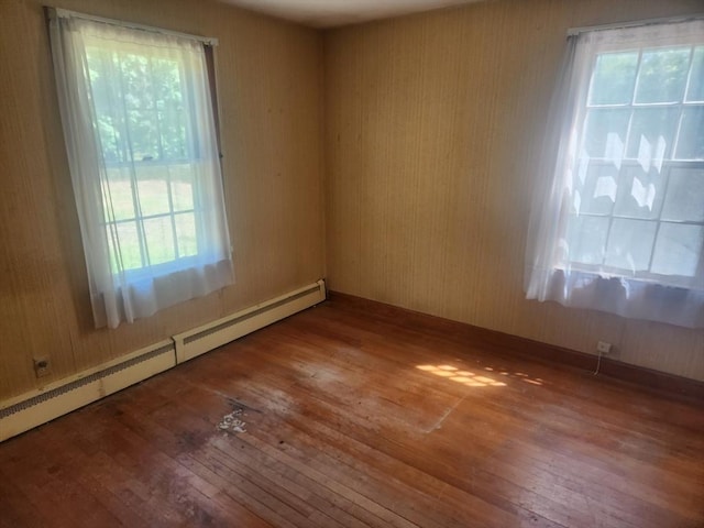 192 White St, Lunenburg, MA 01462 - spare room featuring hardwood / wood-style floors and a baseboard radiator