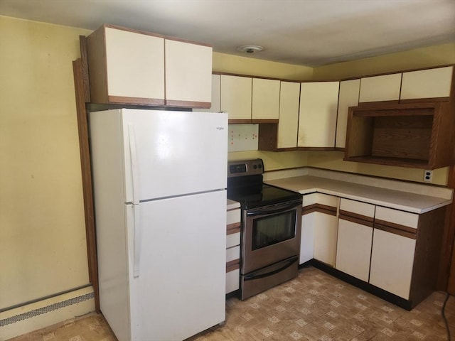 192 White St, Lunenburg, MA 01462 - kitchen with freestanding refrigerator, stainless steel electric range oven, light countertops, and cream cabinets
