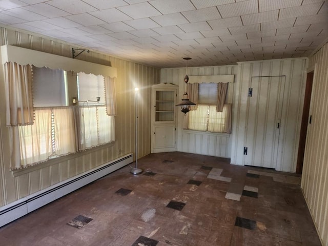 192 White St, Lunenburg, MA 01462 - unfurnished room with a baseboard heating unit and wooden walls