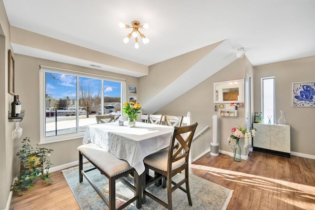 dining area with hardwood / wood-style floors