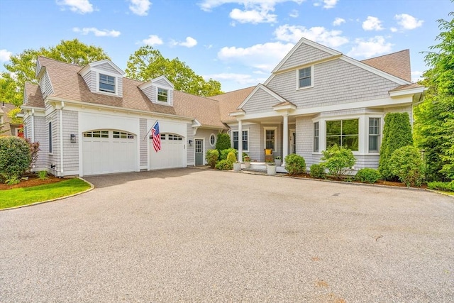 29 Flat Pond Cir, Mashpee, MA 02649 - shingle-style home with a garage, driveway, and roof with shingles