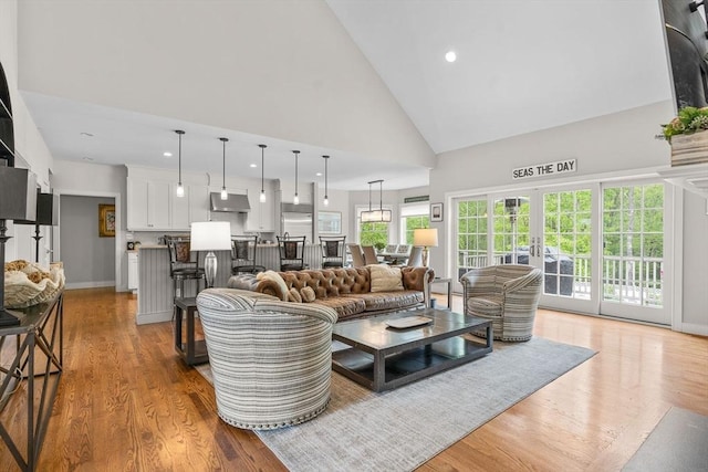 29 Flat Pond Cir, Mashpee, MA 02649 - living room with high vaulted ceiling, light wood finished floors, recessed lighting, and french doors