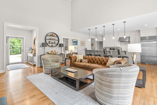 29 Flat Pond Cir, Mashpee, MA 02649 - living room featuring a towering ceiling and light wood-style flooring