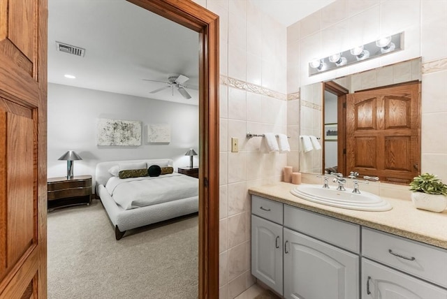 81 Countryside Ln, Milton, MA 02186 - ensuite bathroom featuring tile walls, ceiling fan, and vanity