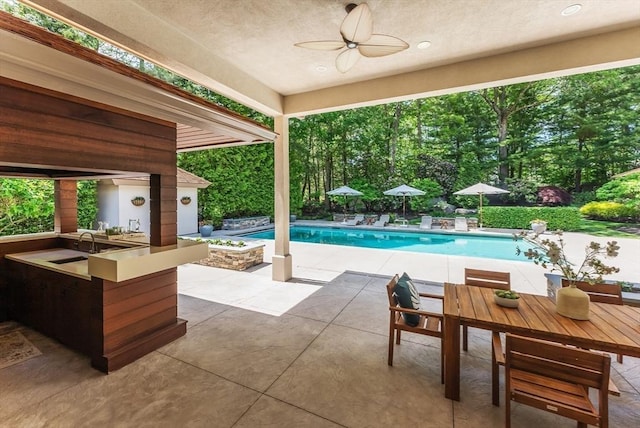 81 Countryside Ln, Milton, MA 02186 - outdoor pool with a patio area, ceiling fan, and view of scattered trees