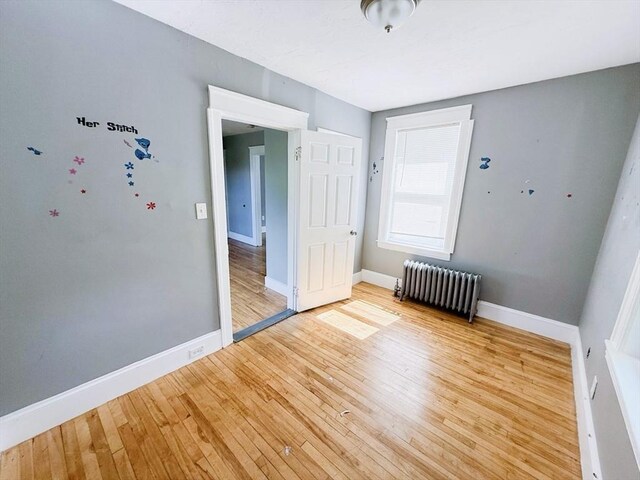 15 Circuit Ave E, Worcester, MA 01603 - unfurnished room with radiator, light wood-style flooring, and baseboards
