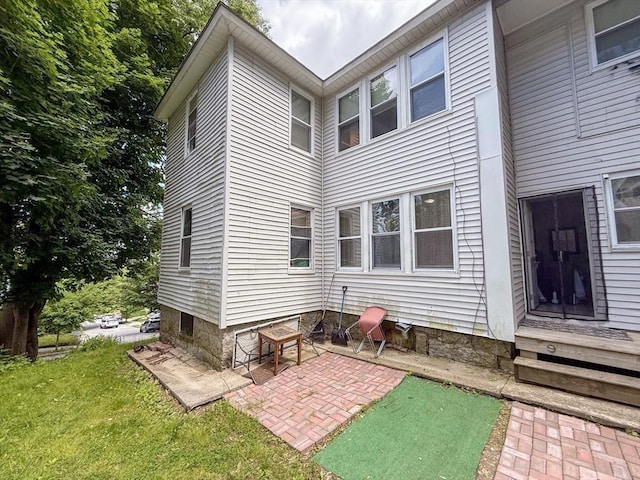 15 Circuit Ave E, Worcester, MA 01603 - rear view of house with a patio area and a yard