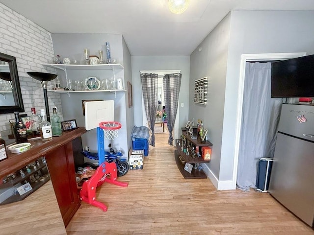 15 Circuit Ave E, Worcester, MA 01603 - interior space featuring freestanding refrigerator, wood finished floors, and brick wall