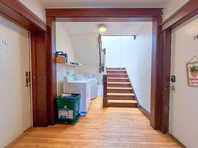 15 Circuit Ave E, Worcester, MA 01603 - hallway featuring light wood-type flooring, washing machine and clothes dryer, and stairs