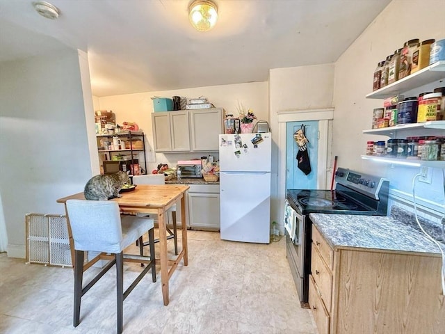15 Circuit Ave E, Worcester, MA 01603 - kitchen featuring freestanding refrigerator, electric stove, and light floors