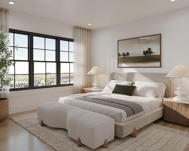 bedroom with wood finished floors and recessed lighting
