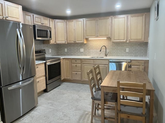 3 Walker Rd Unit 9, North Andover, MA 01845 - kitchen featuring appliances with stainless steel finishes, light brown cabinets, a sink, tasteful backsplash, and recessed lighting