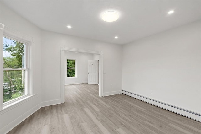 551 Chestnut St, Athol, MA 01331 - empty room featuring a baseboard radiator, plenty of natural light, light wood-style flooring, and recessed lighting