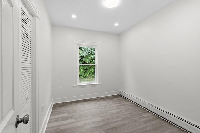 551 Chestnut St, Athol, MA 01331 - unfurnished bedroom with a baseboard heating unit, recessed lighting, wood finished floors, and a closet