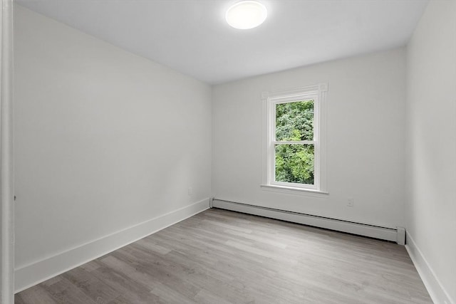 551 Chestnut St, Athol, MA 01331 - spare room featuring a baseboard radiator and wood finished floors