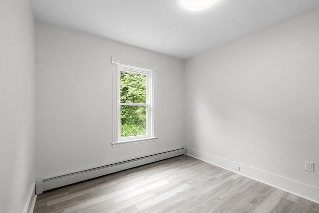 551 Chestnut St, Athol, MA 01331 - empty room with baseboard heating and wood finished floors