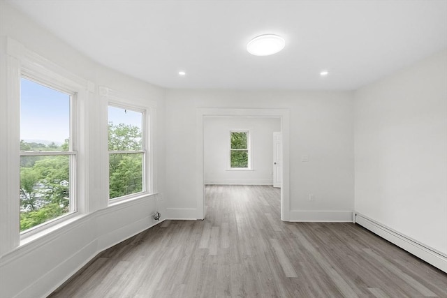 551 Chestnut St, Athol, MA 01331 - empty room featuring plenty of natural light, baseboard heating, light wood-style flooring, and recessed lighting