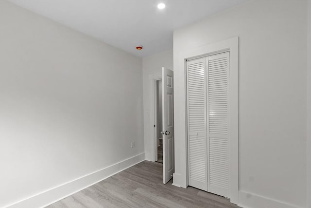 551 Chestnut St, Athol, MA 01331 - unfurnished bedroom featuring wood finished floors, a closet, and recessed lighting