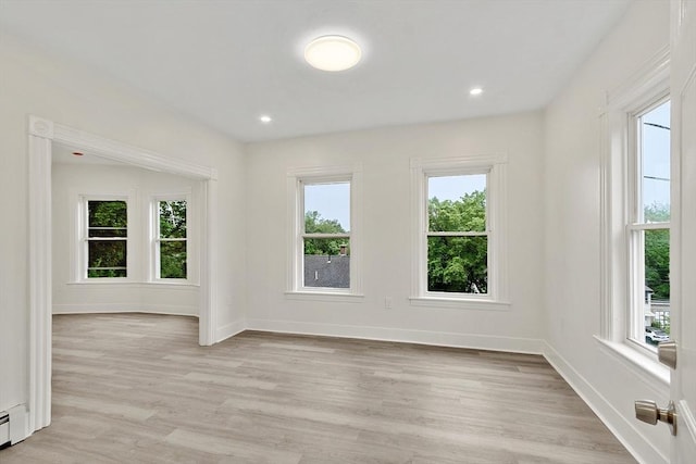 551 Chestnut St, Athol, MA 01331 - empty room featuring light wood-style floors, a baseboard heating unit, and recessed lighting