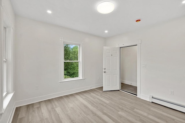551 Chestnut St, Athol, MA 01331 - spare room with a baseboard heating unit, light wood finished floors, and recessed lighting