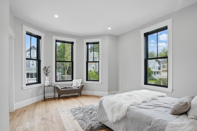 61 Lyndhurst St Unit A, Boston, MA 02124 - bedroom featuring light wood-style flooring, baseboards, and recessed lighting