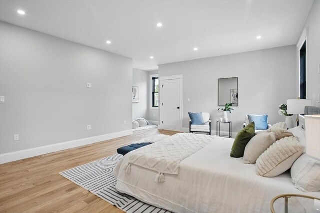 61 Lyndhurst St Unit A, Boston, MA 02124 - bedroom featuring wood finished floors, recessed lighting, and baseboards