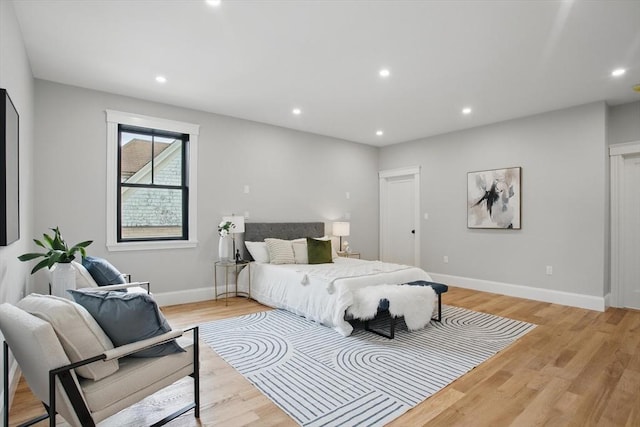 61 Lyndhurst St Unit A, Boston, MA 02124 - bedroom with light wood-type flooring, recessed lighting, and baseboards
