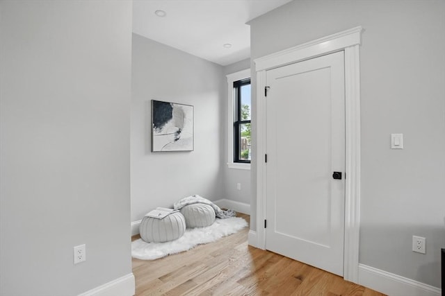 61 Lyndhurst St Unit A, Boston, MA 02124 - foyer featuring baseboards and light wood finished floors