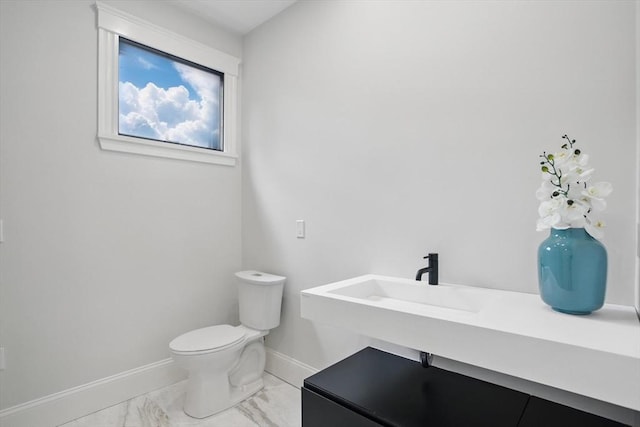 61 Lyndhurst St Unit A, Boston, MA 02124 - half bath with marble look tiles, toilet, and baseboards