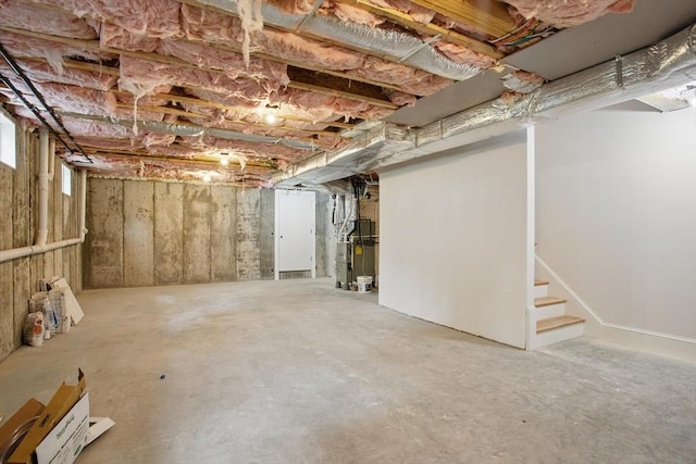 61 Lyndhurst St Unit A, Boston, MA 02124 - unfinished below grade area with stairway and heating unit
